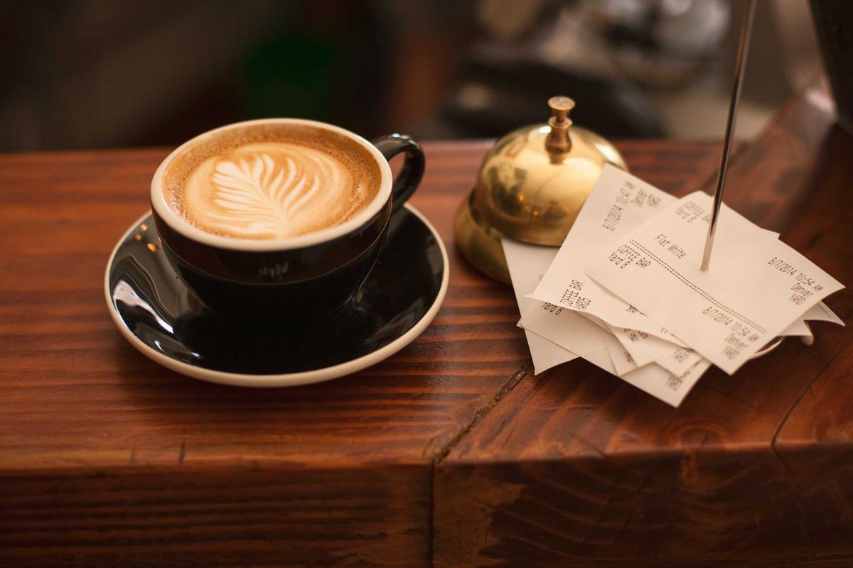 A cup of coffee on a wooden table