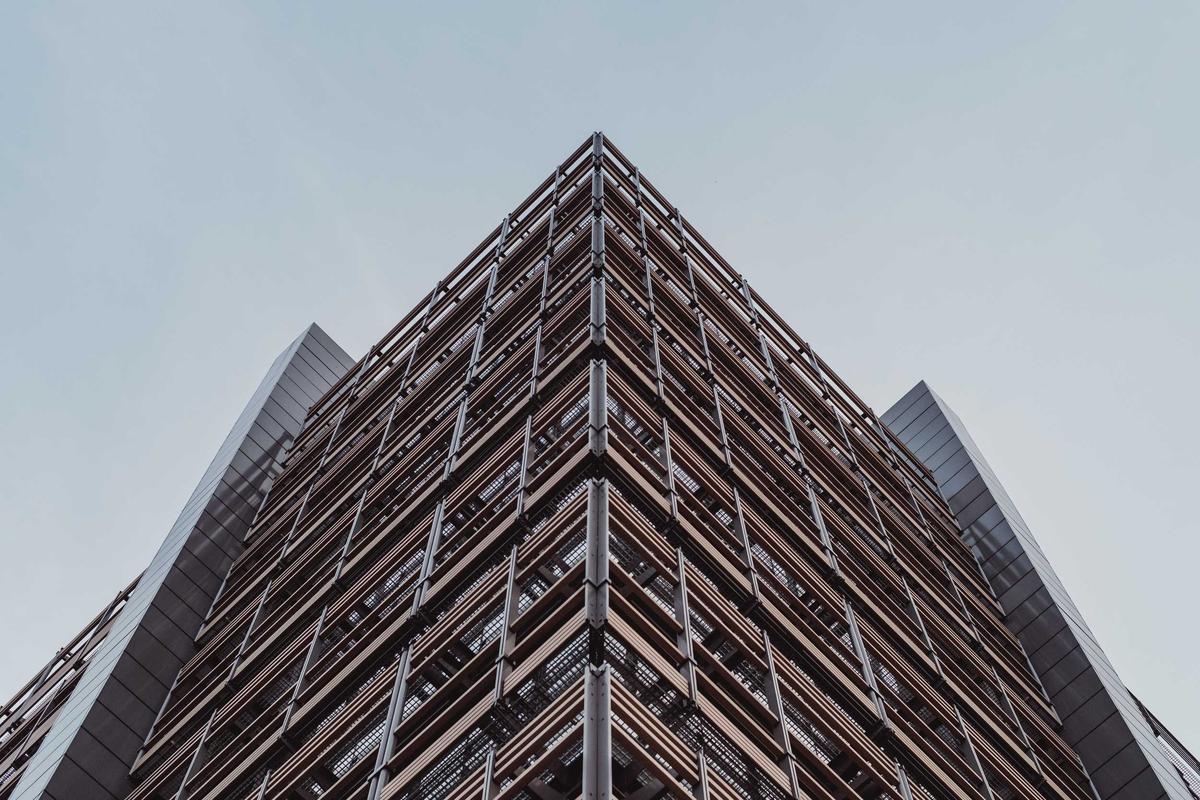 A tall building seen from below against a clear sky